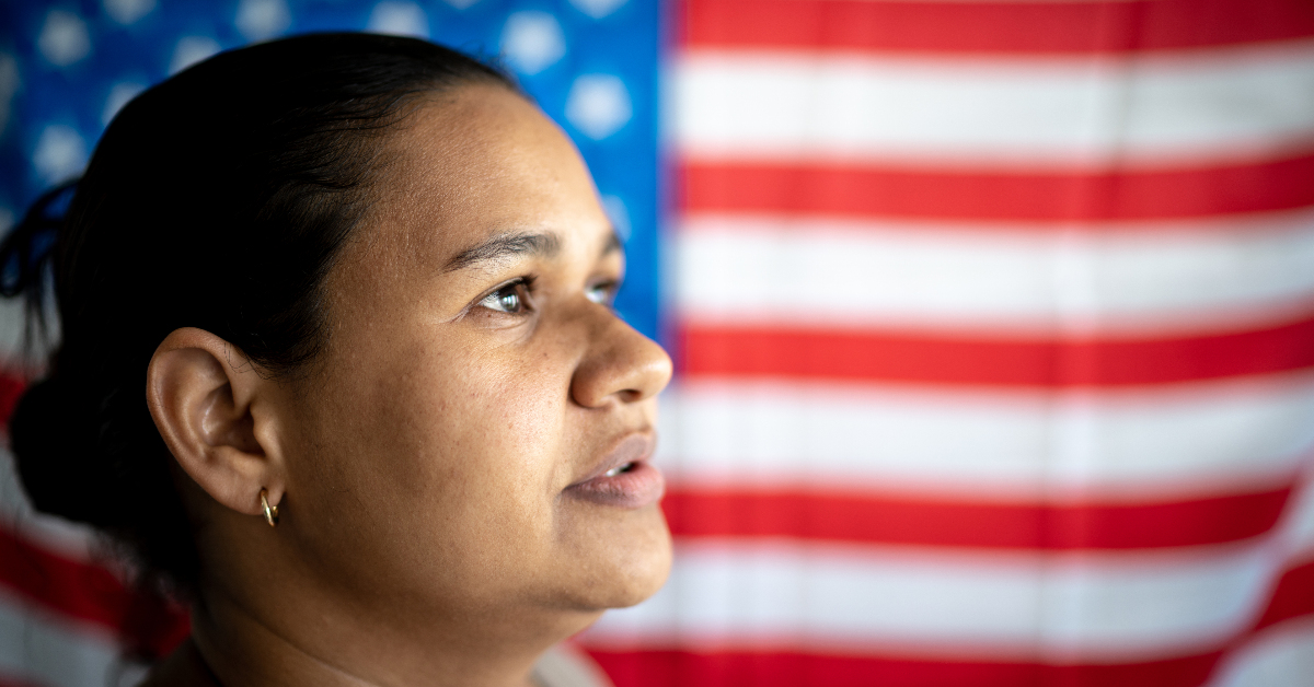 portrait-of-woman-with-american-flag-on-background